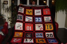 Aaron and his hockey quilt.JPG